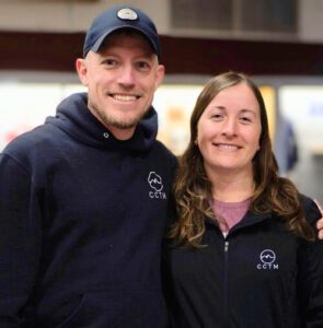 Dan Hogan standing with His wife Hannah.